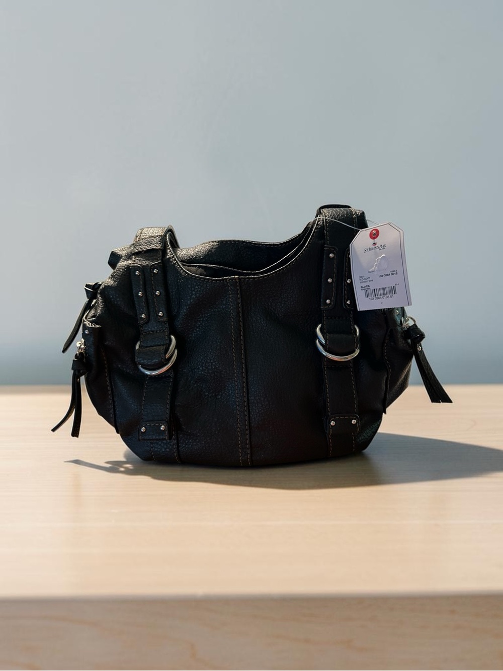Brand New black pebbled faux-leather shoulder bag from the brand St. John's Bay